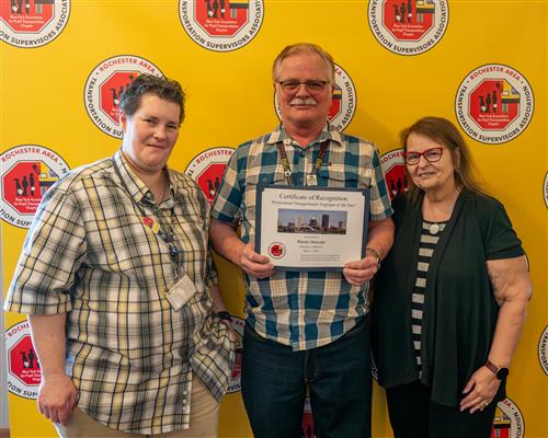Kevin Hoover poses for a picture with Paula Powell and Denise Hazzard.